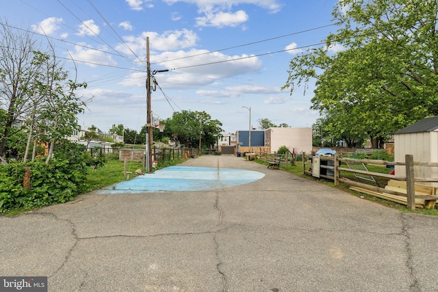 1707 D St SE, Washington, DC 20003 - view of asphalt road featuring street lighting and a gate
