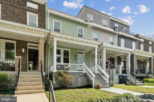 1707 D St SE, Washington, DC 20003 - townhome / multi-family property with covered porch and brick siding