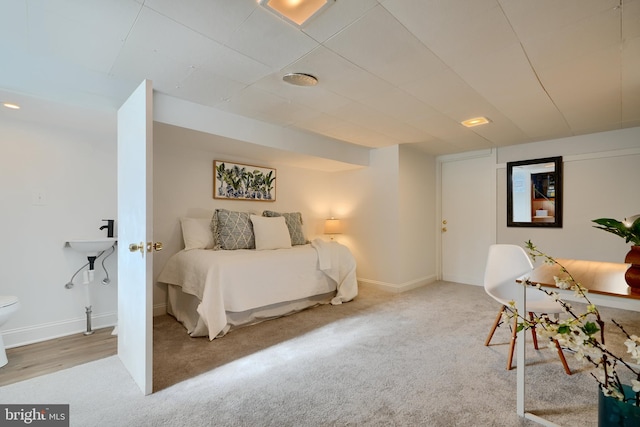 carpeted bedroom featuring baseboards