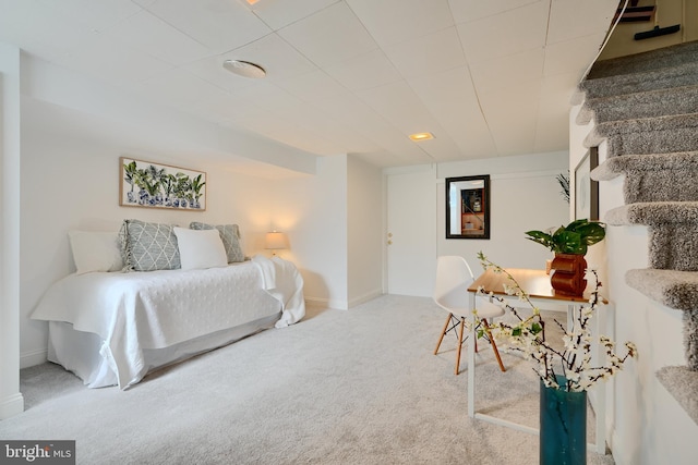 bedroom featuring carpet floors and baseboards