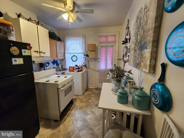 kitchen with white range with electric stovetop, washer / clothes dryer, freestanding refrigerator, a sink, and under cabinet range hood