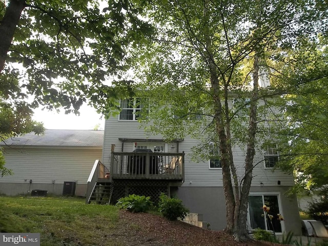 back of house featuring a wooden deck, central air condition unit, and stairway