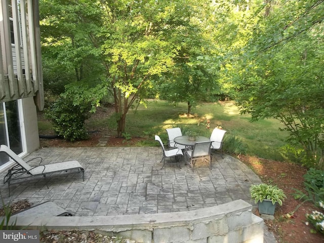 view of patio featuring outdoor dining area