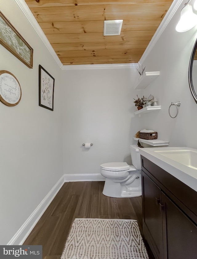 bathroom featuring visible vents, wood finished floors, wooden ceiling, crown molding, and vanity