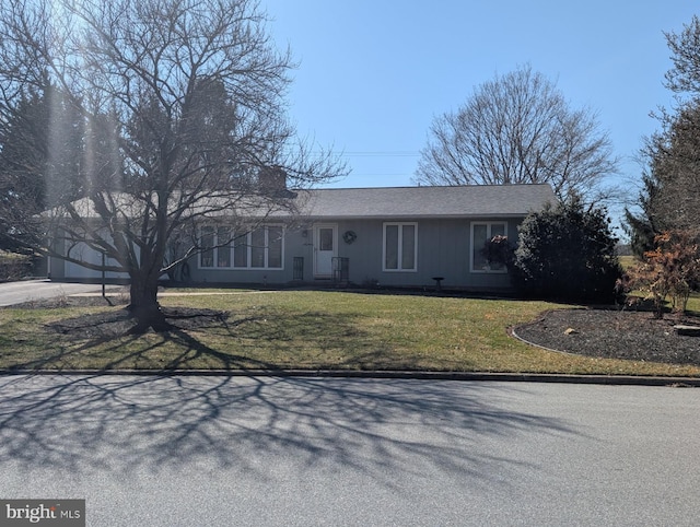 view of front of house featuring a front yard and driveway