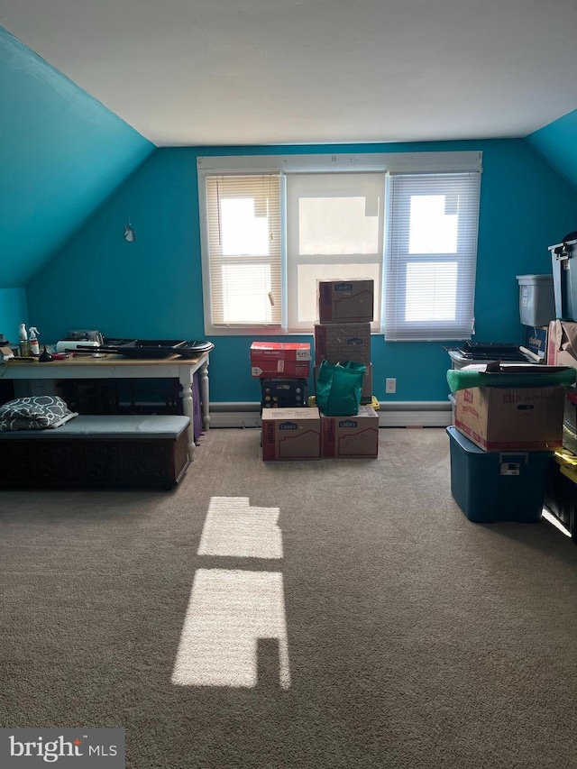 recreation room with carpet floors, vaulted ceiling, and plenty of natural light