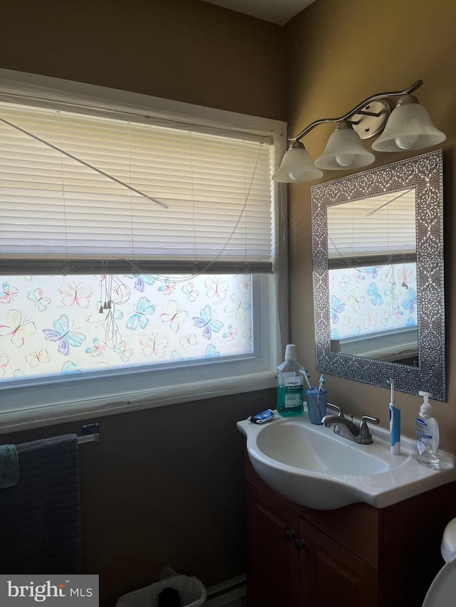 bathroom featuring a baseboard radiator and vanity