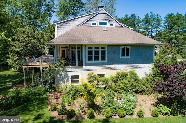 4873 Anchors Way, Galesville, MD 20765 - back of property featuring a ceiling fan, a deck, roof with shingles, and a lawn