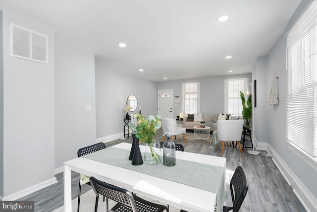 dining room featuring visible vents, recessed lighting, baseboards, and wood finished floors