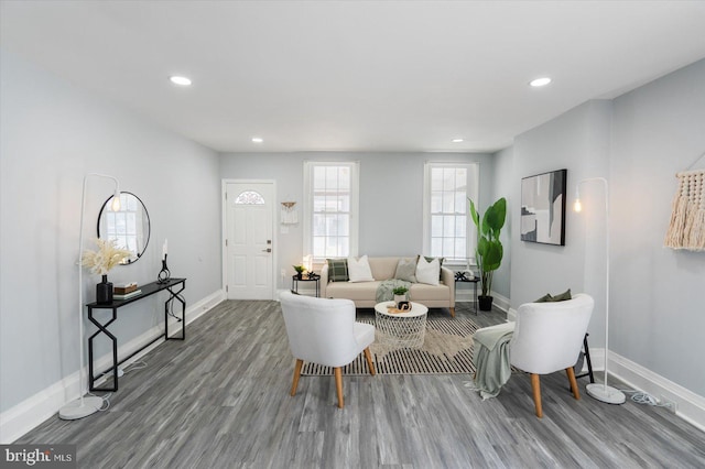 living room with recessed lighting, wood finished floors, and baseboards