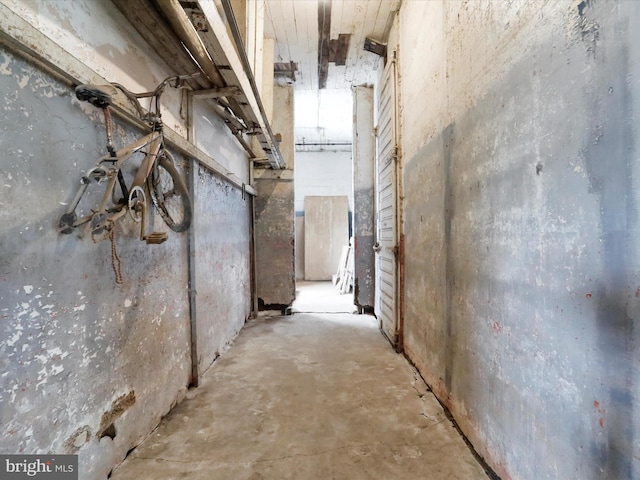 hall featuring concrete floors