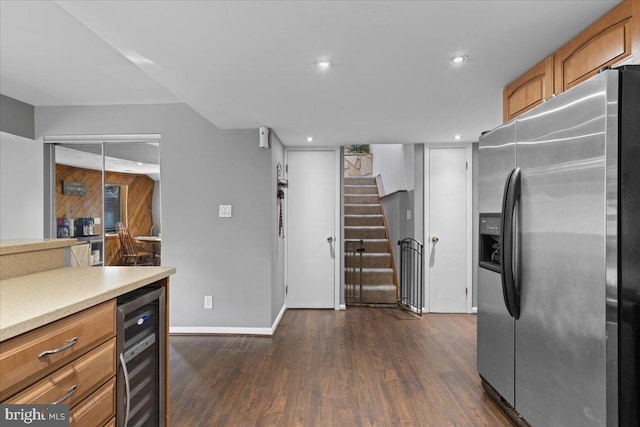 kitchen with wine cooler, light countertops, dark wood-style floors, brown cabinetry, and stainless steel fridge