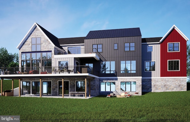 rear view of property featuring a balcony, stone siding, board and batten siding, and a yard