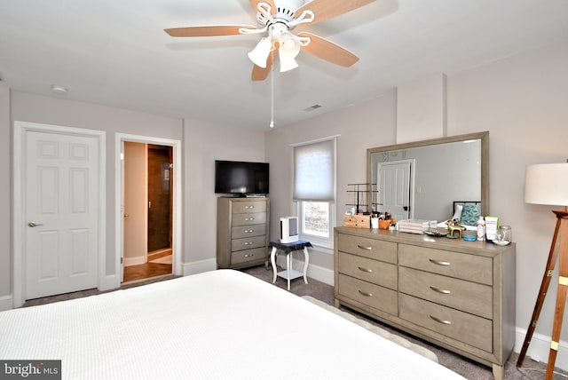 carpeted bedroom featuring visible vents, baseboards, and a ceiling fan