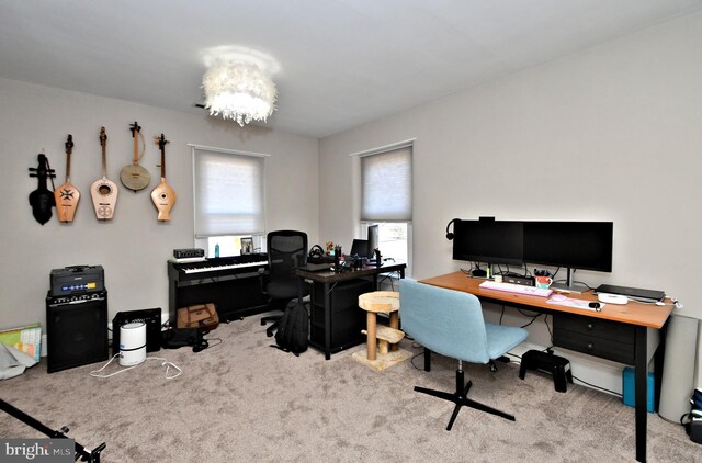 office area with carpet flooring and a notable chandelier