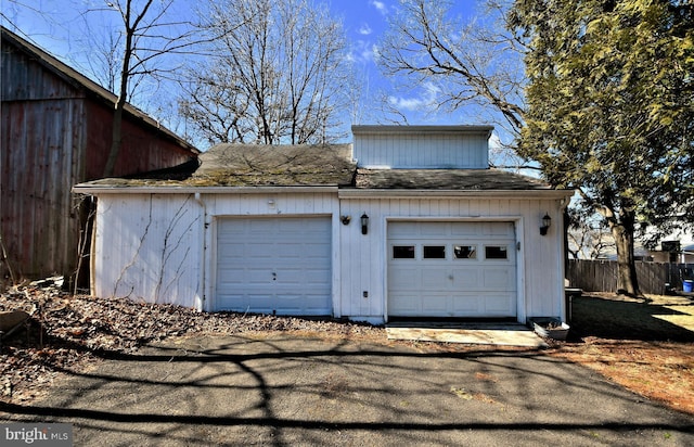 garage with fence