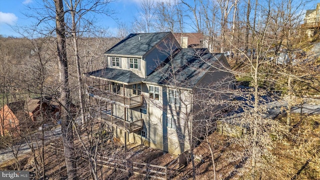 view of home's exterior featuring a chimney