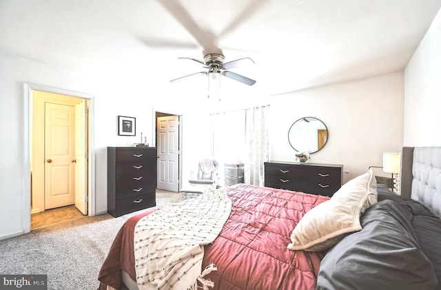 carpeted bedroom with a ceiling fan