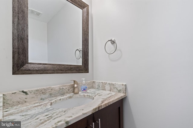 bathroom featuring vanity and visible vents