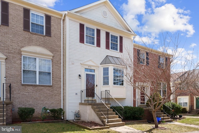 view of property featuring brick siding