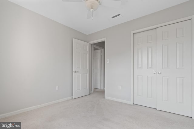 unfurnished bedroom featuring a ceiling fan, baseboards, visible vents, carpet floors, and a closet