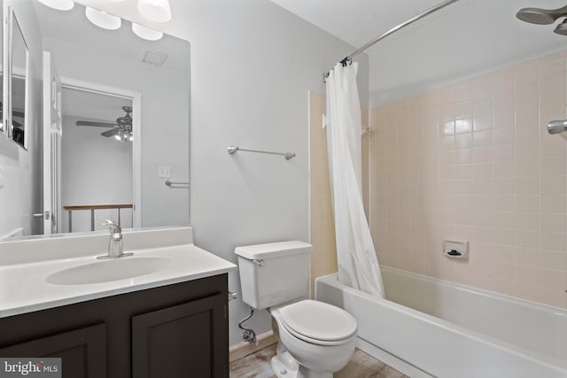 bathroom featuring shower / tub combo with curtain, toilet, a ceiling fan, wood finished floors, and vanity