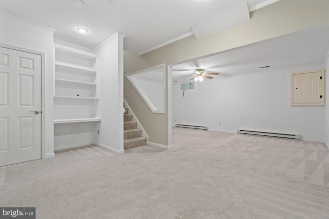 basement with baseboard heating, stairway, and ornamental molding