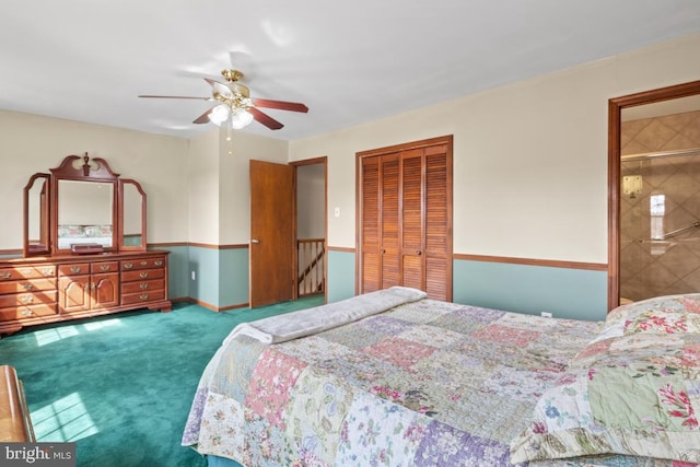 bedroom featuring baseboards, carpet flooring, ensuite bathroom, a closet, and a ceiling fan