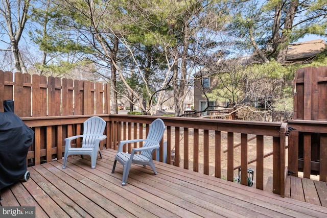 deck with grilling area and fence