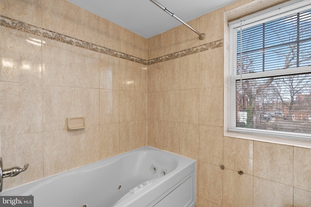 full bath featuring tile walls