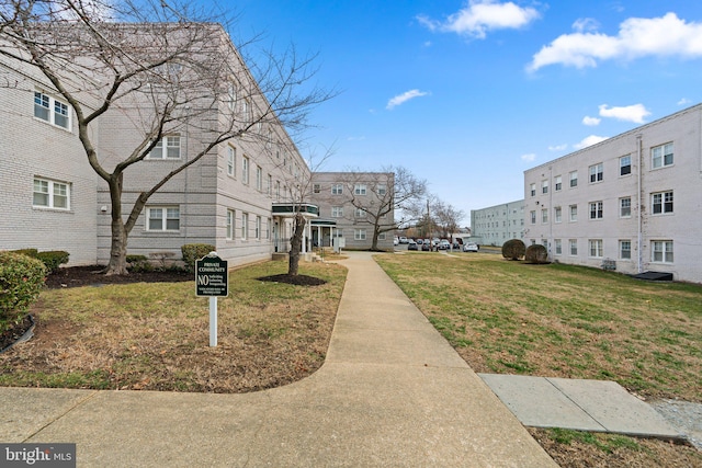 view of property's community with a yard