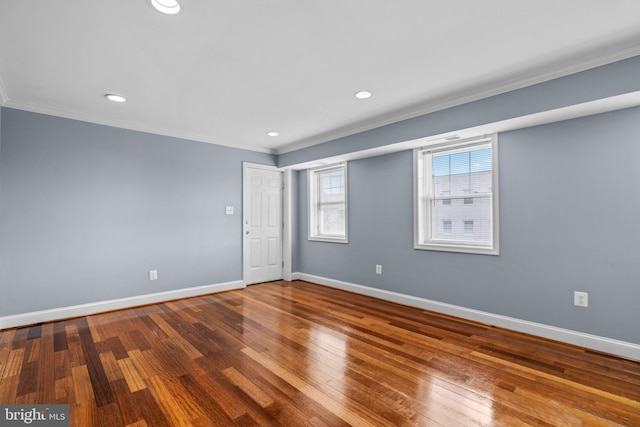 unfurnished room with hardwood / wood-style flooring, recessed lighting, baseboards, and ornamental molding