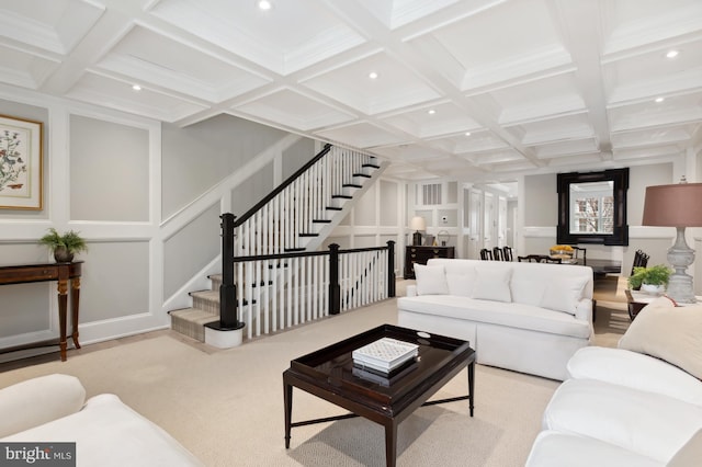 carpeted living area with stairway, a decorative wall, recessed lighting, and beamed ceiling