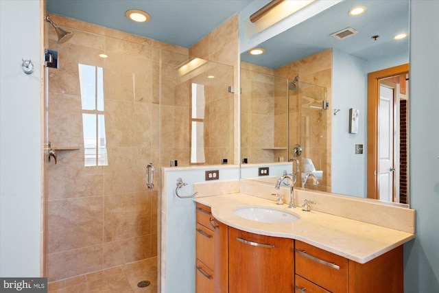 full bathroom featuring recessed lighting, visible vents, a stall shower, and vanity