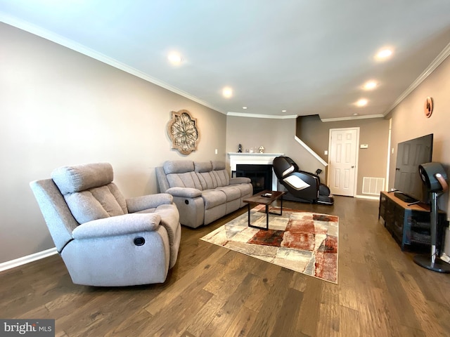 living room with a fireplace, dark wood finished floors, visible vents, and recessed lighting