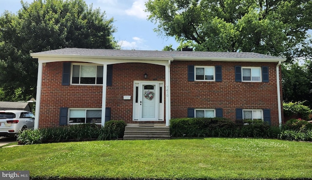 1410 Hallwood Rd, Baltimore, MD 21228 - bi-level home with a front lawn and brick siding
