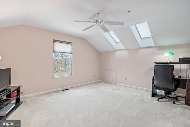 office area with visible vents, baseboards, lofted ceiling, and carpet flooring