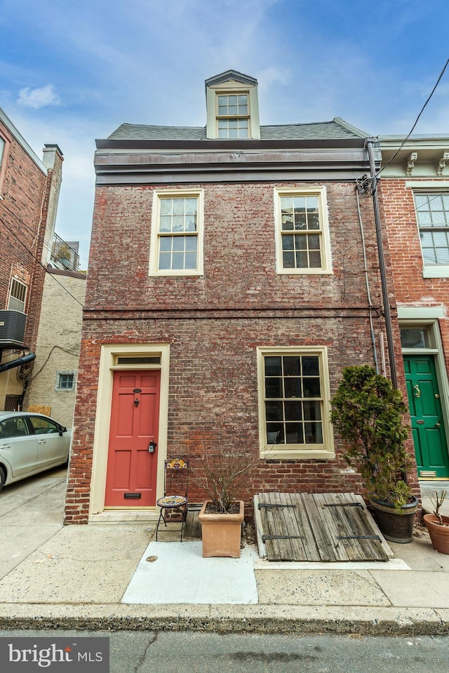 view of front of home with brick siding