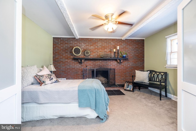 bedroom with baseboards, ceiling fan, carpet, a fireplace, and beam ceiling