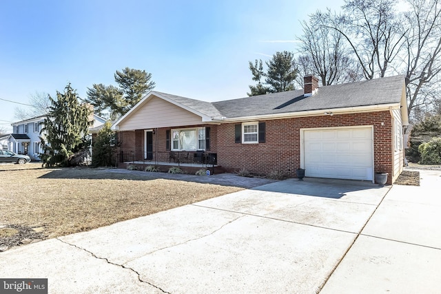 single story home featuring an attached garage, driveway, a chimney, and brick siding