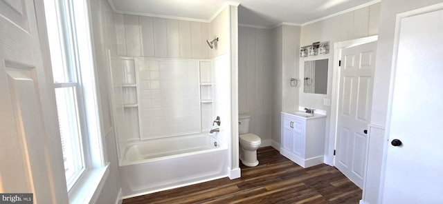 bathroom featuring crown molding, toilet, wood finished floors, vanity, and  shower combination