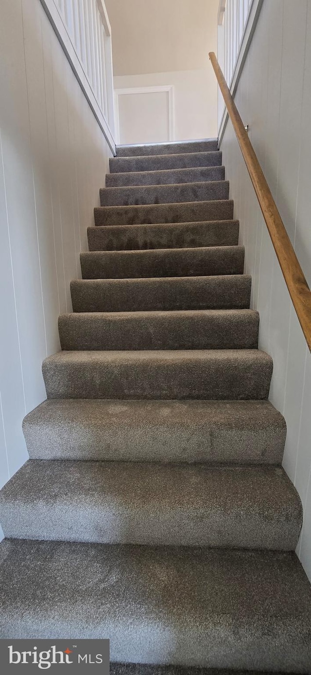 stairs with a decorative wall