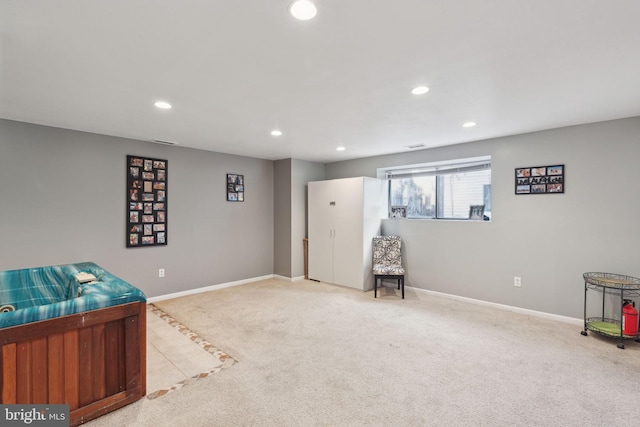 living area featuring recessed lighting, baseboards, and carpet floors