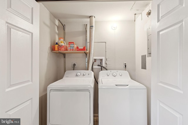 washroom featuring laundry area and separate washer and dryer