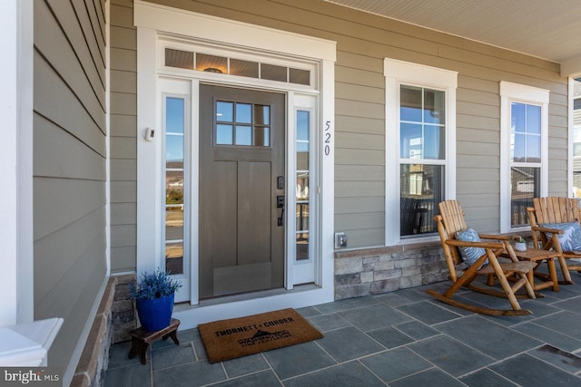 property entrance featuring covered porch