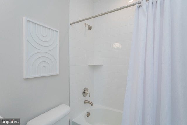 bathroom with shower / bath combo and toilet