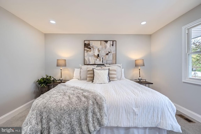 bedroom with carpet, visible vents, baseboards, and recessed lighting