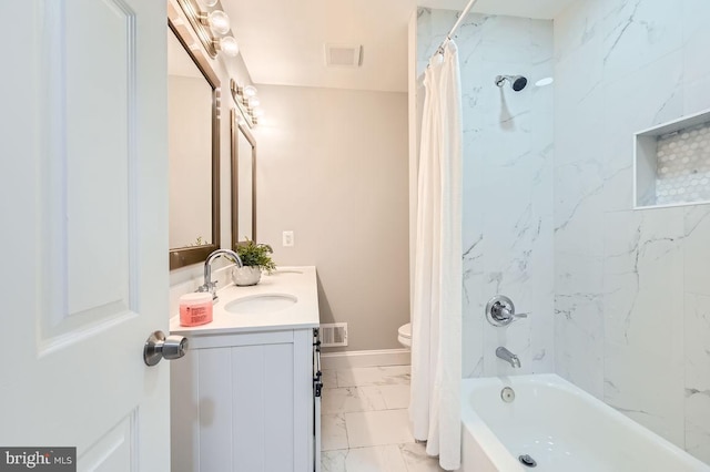 bathroom with toilet, vanity, visible vents, marble finish floor, and shower / bath combo