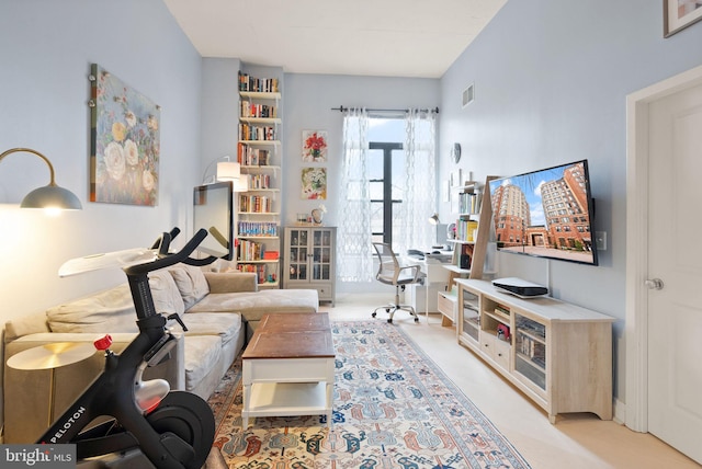 living room featuring light colored carpet and visible vents