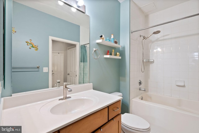 bathroom featuring shower / tub combo, vanity, and toilet